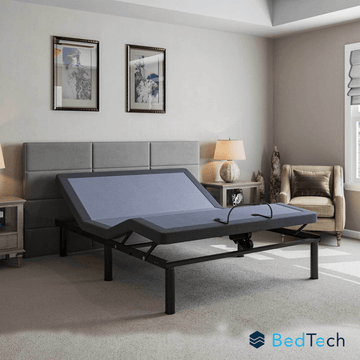 BedTech adjustable bed in a bedroom setting with a gray headboard.