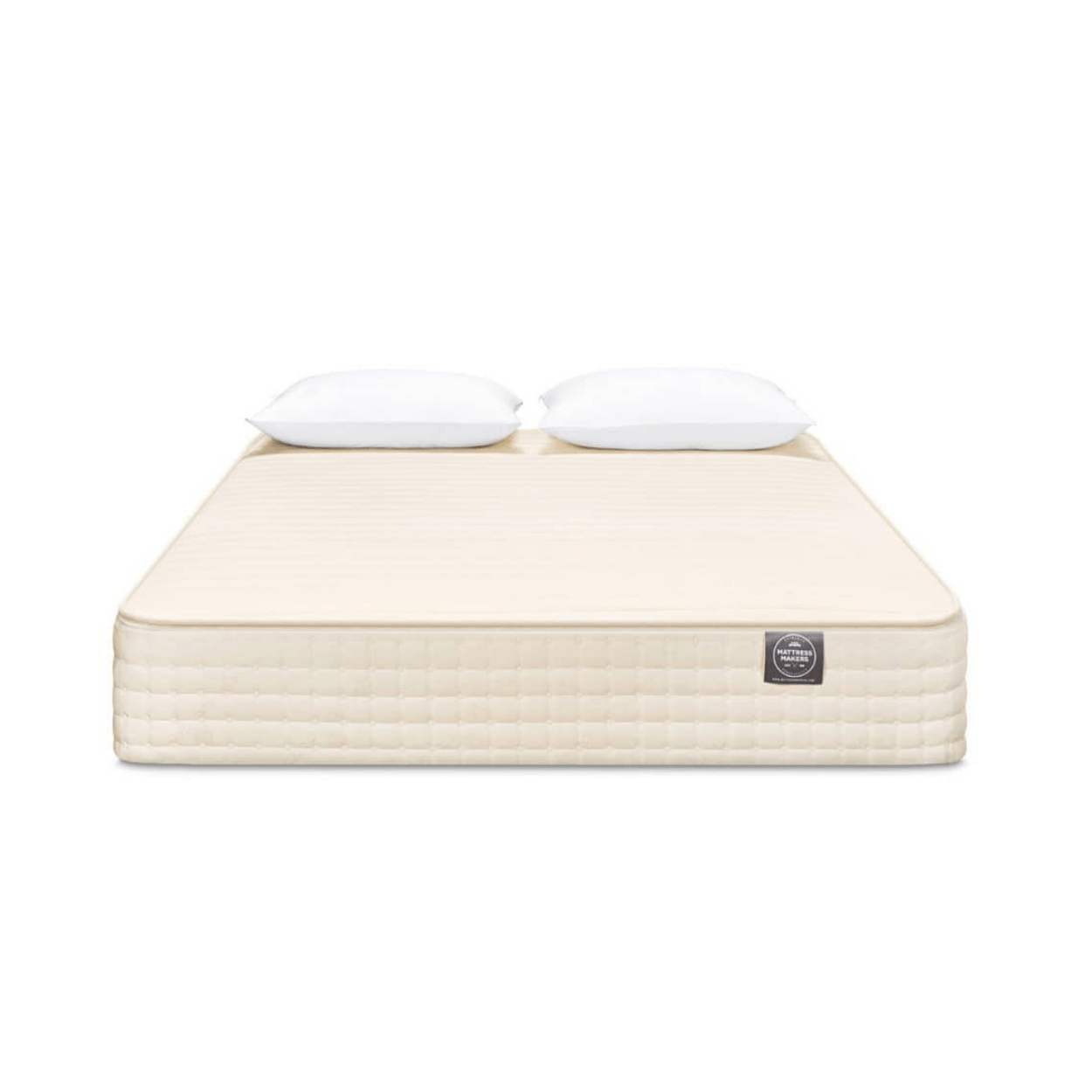 Beige Mattress Makers mattress with two white pillows on a white background