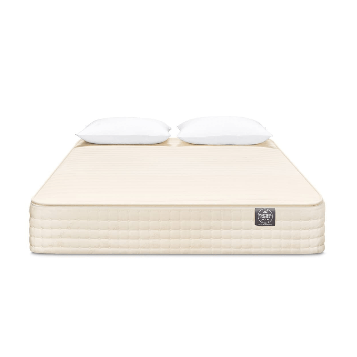 Beige Mattress Makers mattress with two white pillows on a white background